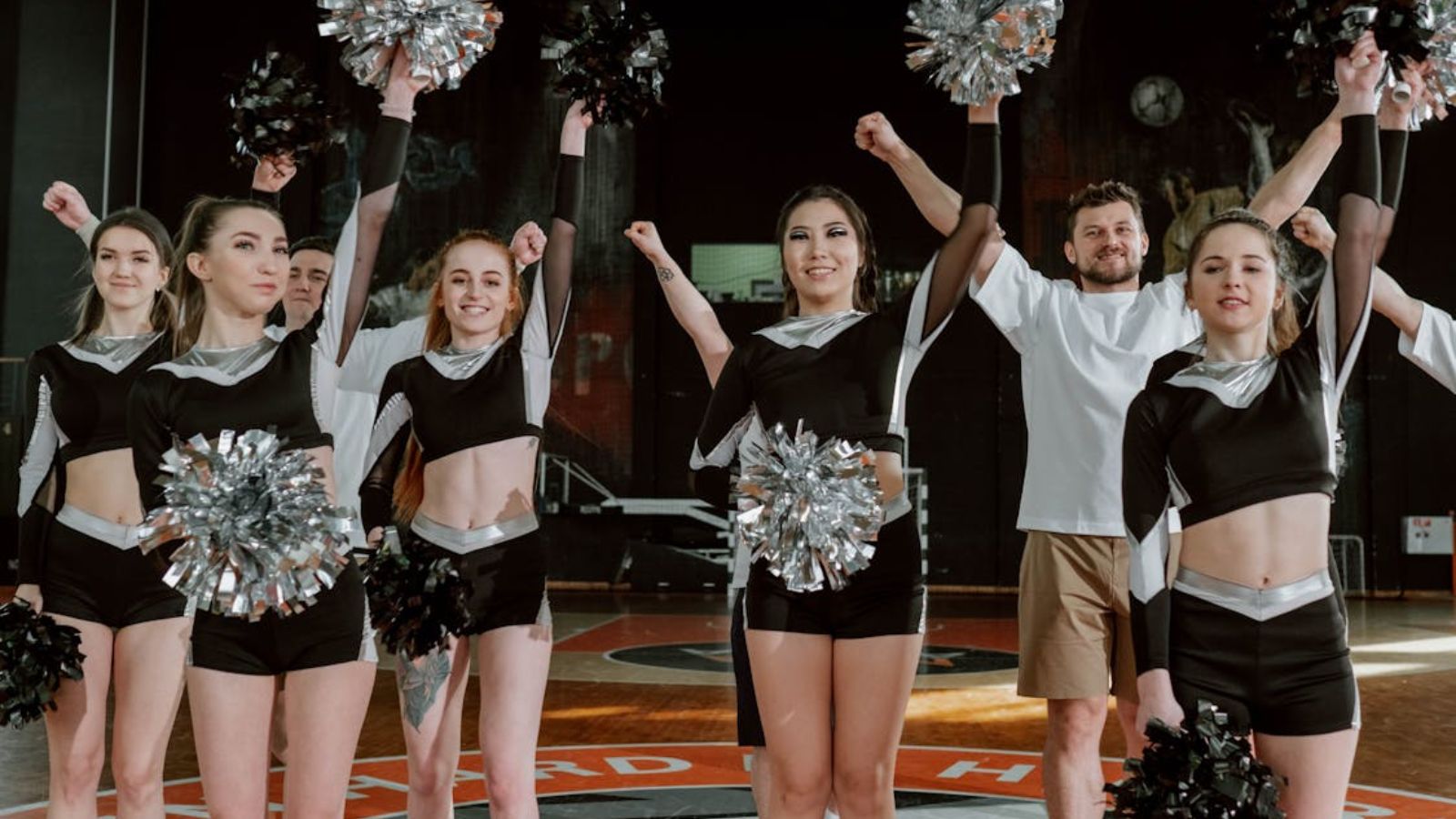 dancers in black and white uniforms